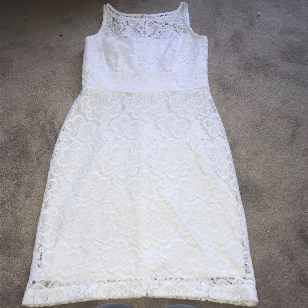 Women’s white floral dress.
